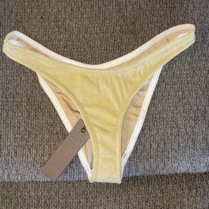 Cheeky gold sparkle bathing suit bottom / white lining.
